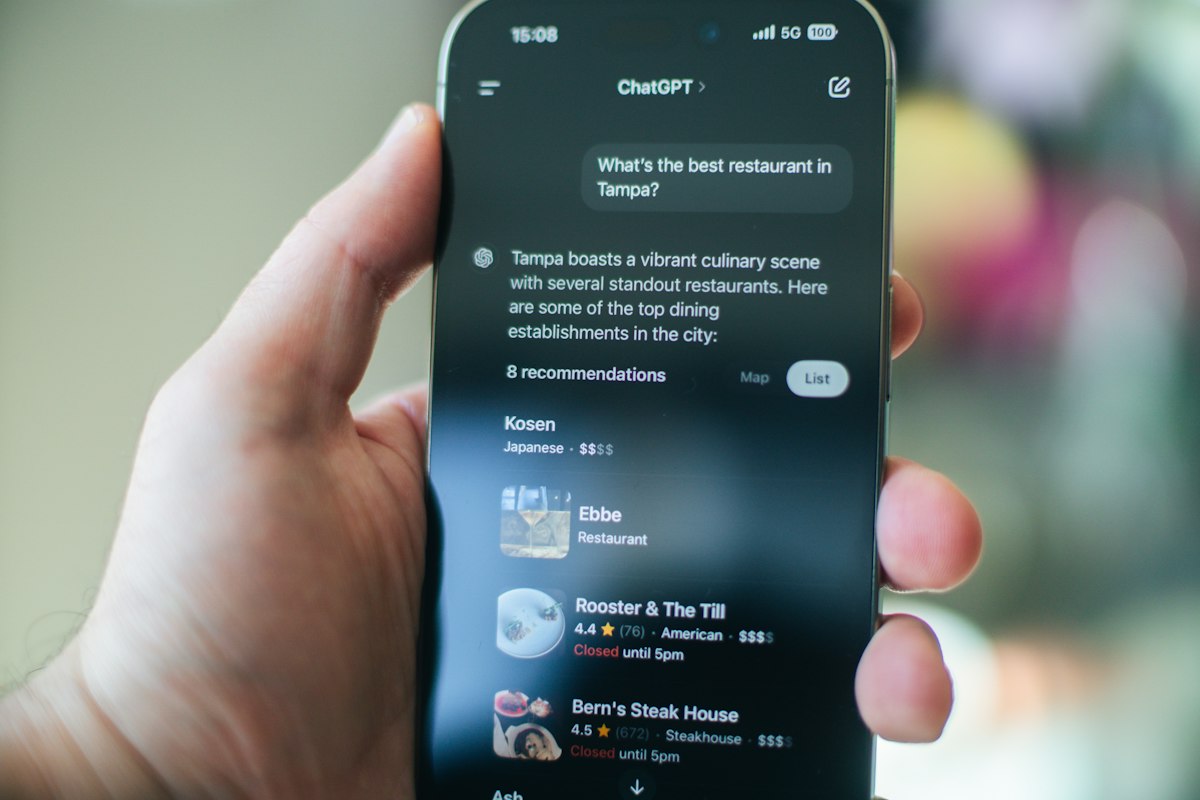 A phone showing an AI assistant recommending local restaurants