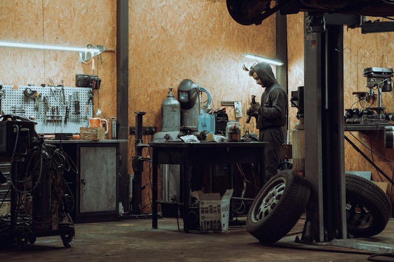 A mechanic working in an auto repair garage